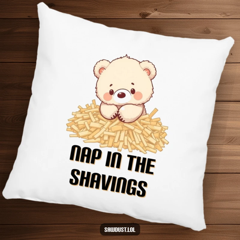 Funny pillow featuring a happy, fluffy bear cub nestled and playing within a pile of wood shavings.